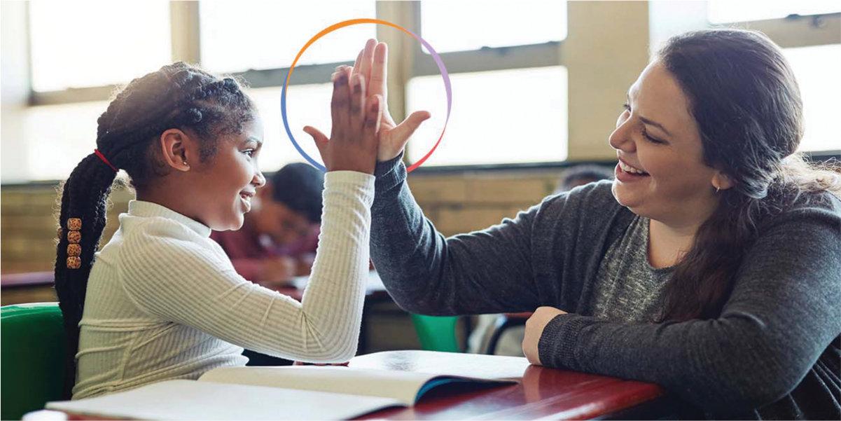Teacher and student high-fiving